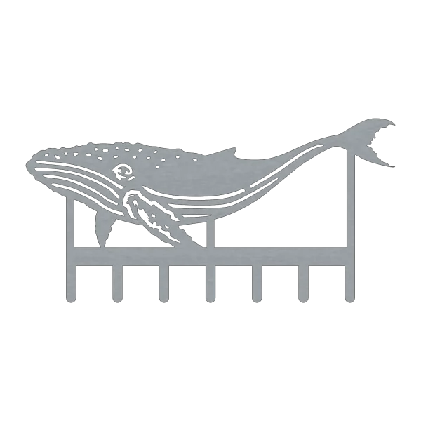 A detailed steel key rack depicting a humpback whale with intricate cutouts. The whale design is sleek and modern, featuring seven hooks for keys.